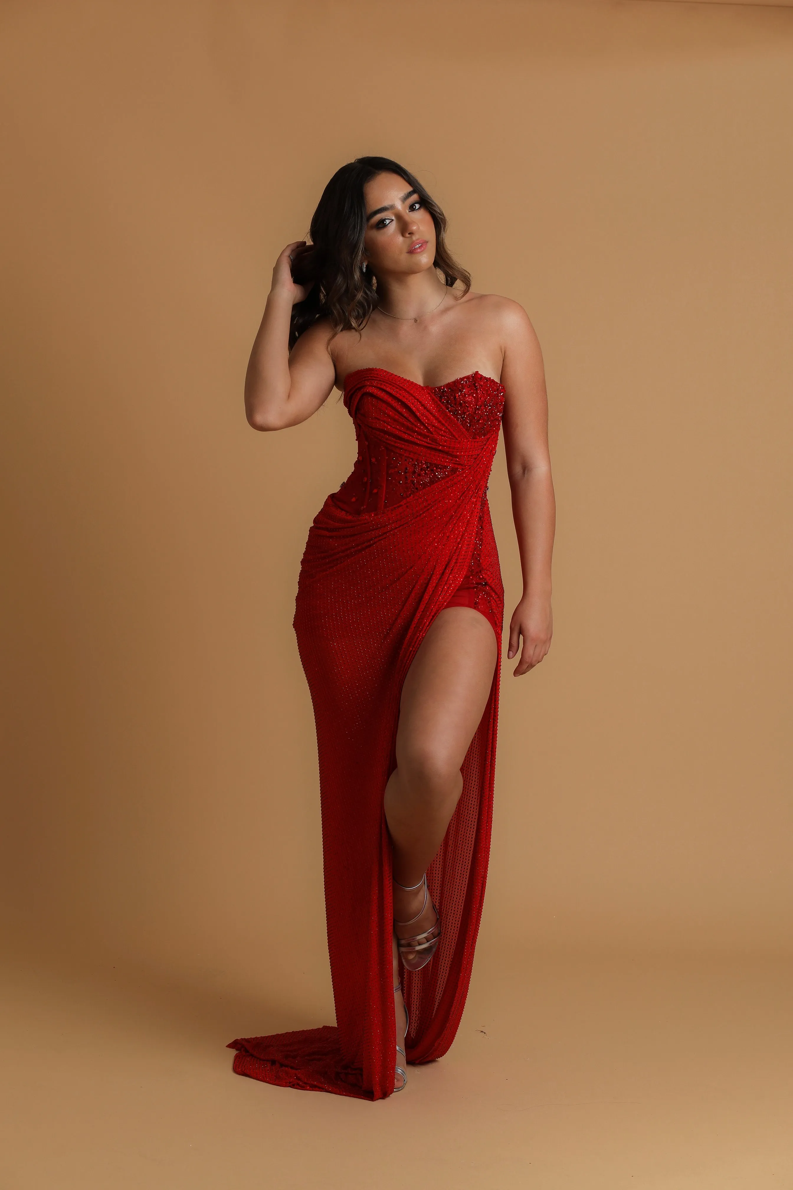 Red satin column shaped dress with high slit