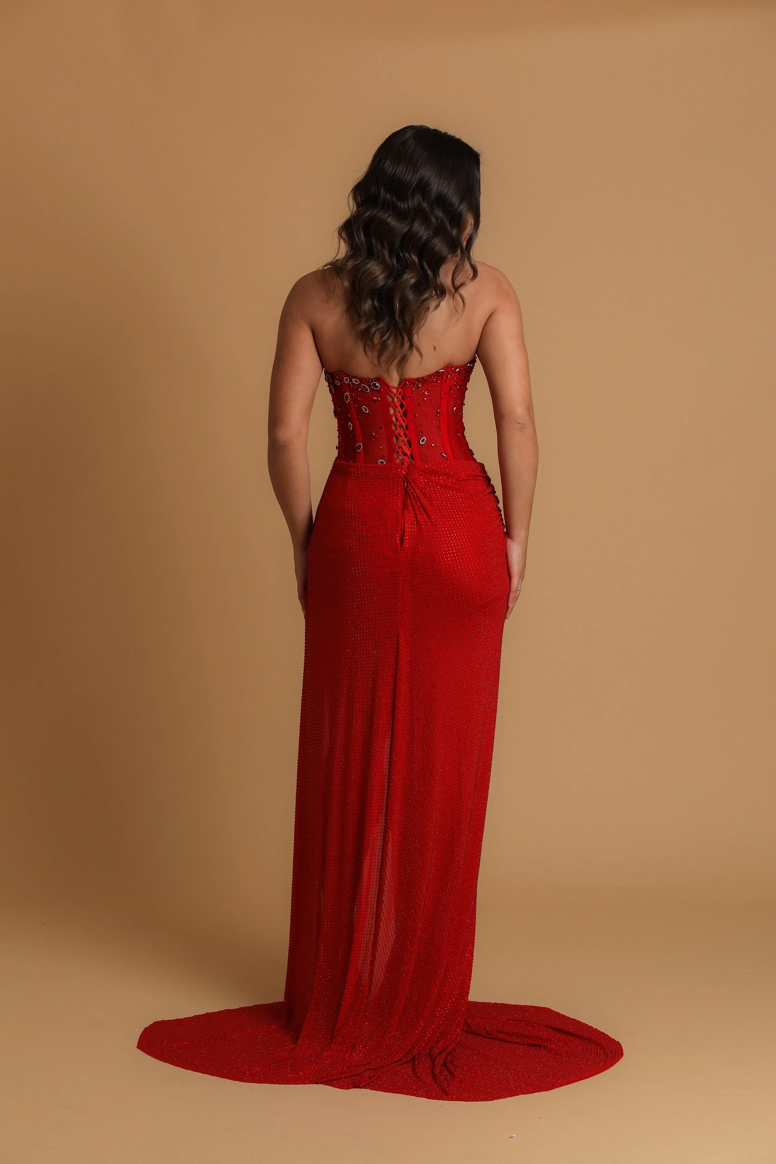 Red satin column shaped dress with high slit